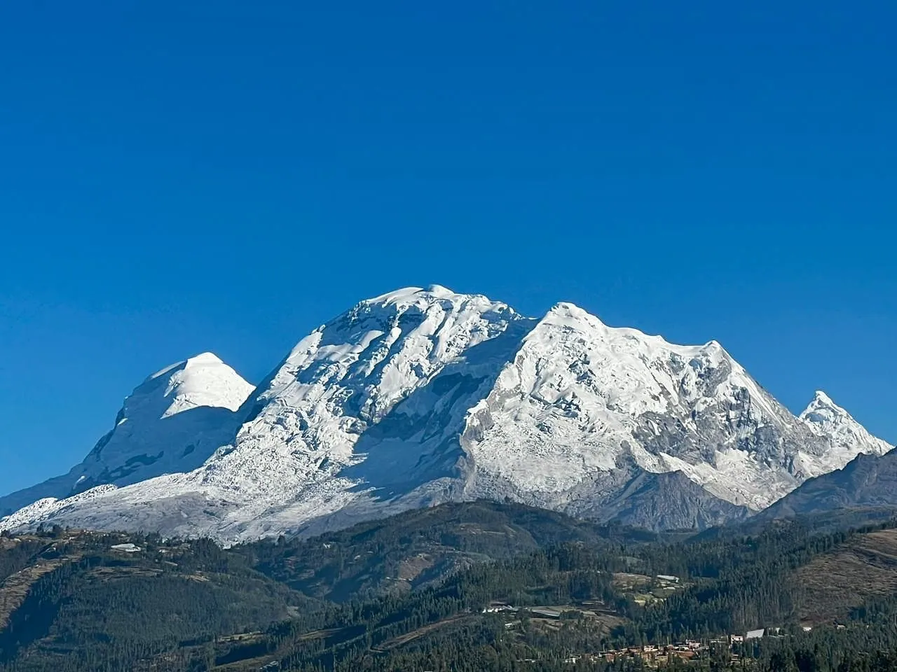 Huascarán and the Cordillera Blanca under a deep blue sky, seen from Yungay