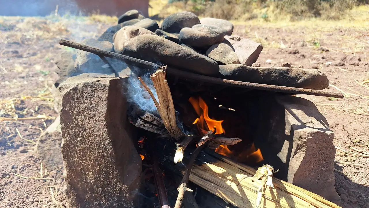 Stone oven with a fire for a watia, traditional Andean cooking