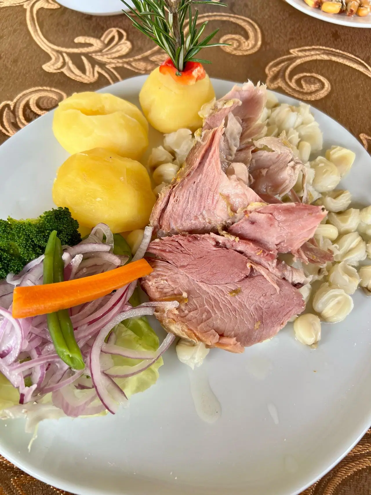 Andean plate with meat, potatoes, hominy corn and vegetables