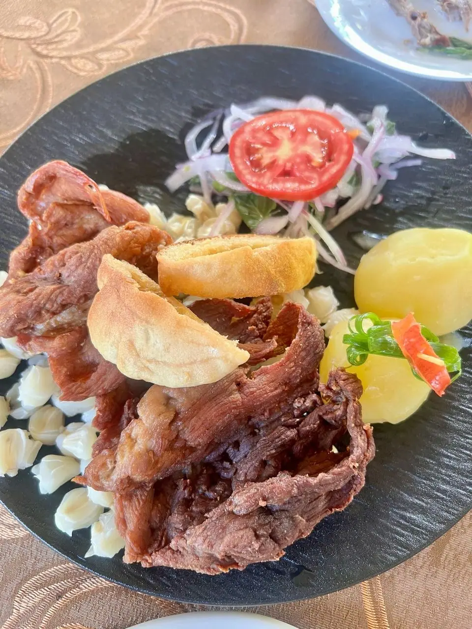 Local dish served with hominy corn and potatoes